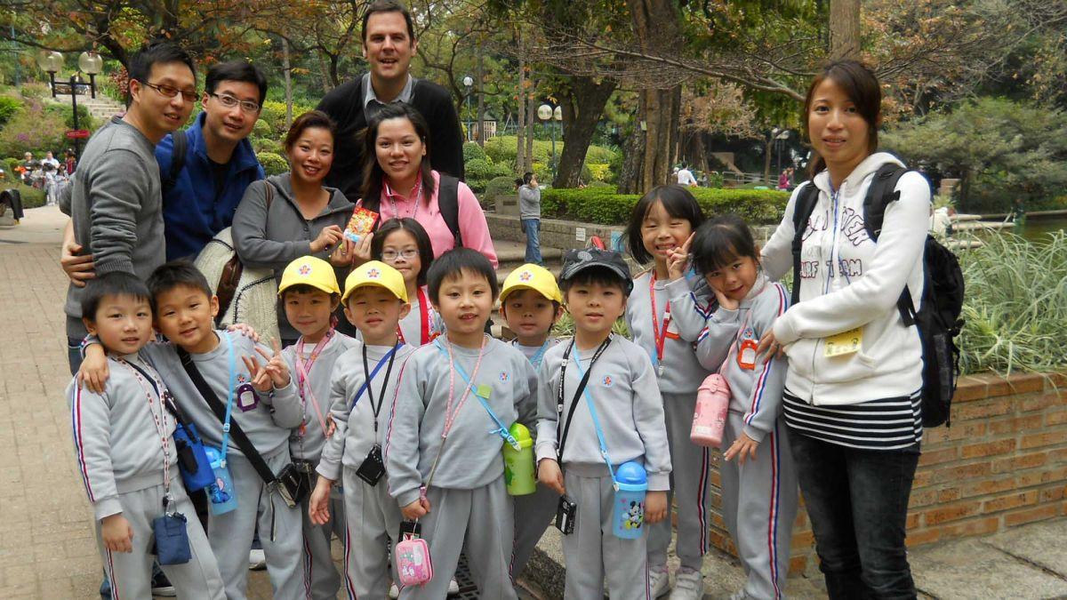 employees with group of children CSR activity kids