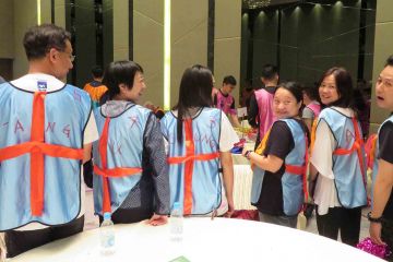group photo showing the back of soccer team vest team building activity goall