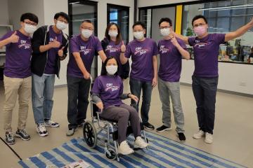 Happy team with completely built wheelchair