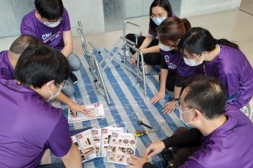 Team with wheelchair plan