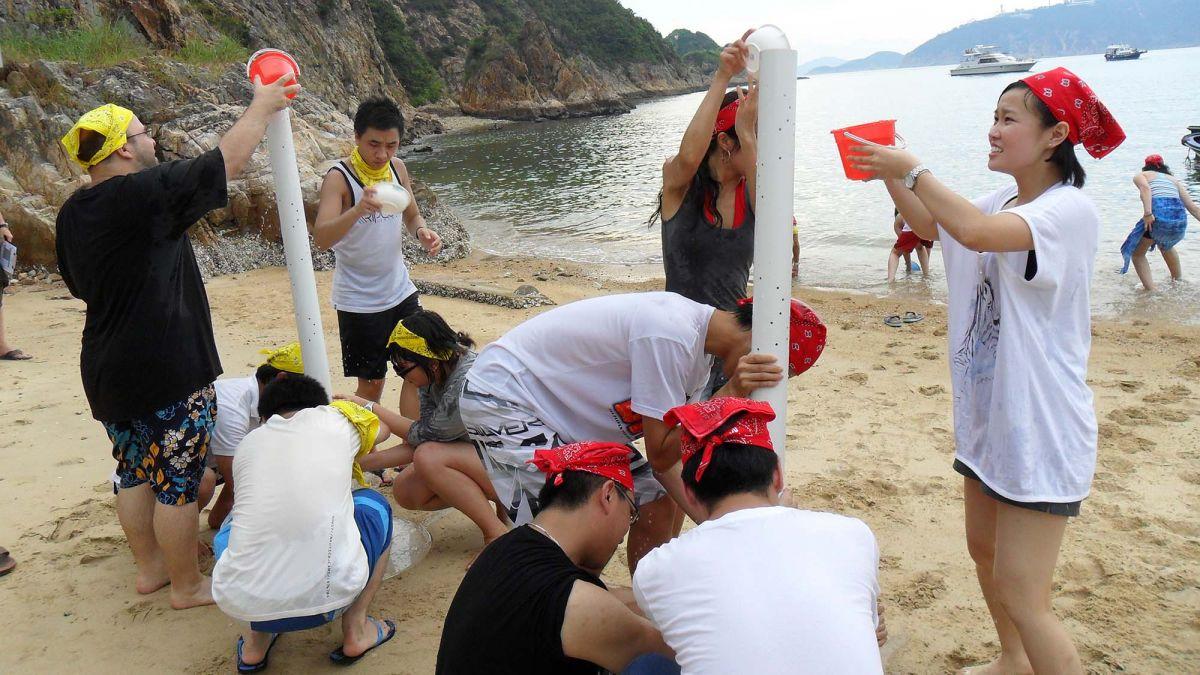 people bonding on the beach relaxing outdoor team building activity beach