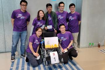 Happy team with completely built wheelchair